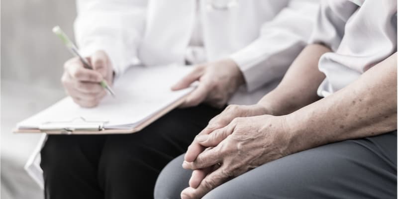 Psychologist helping an elderly person