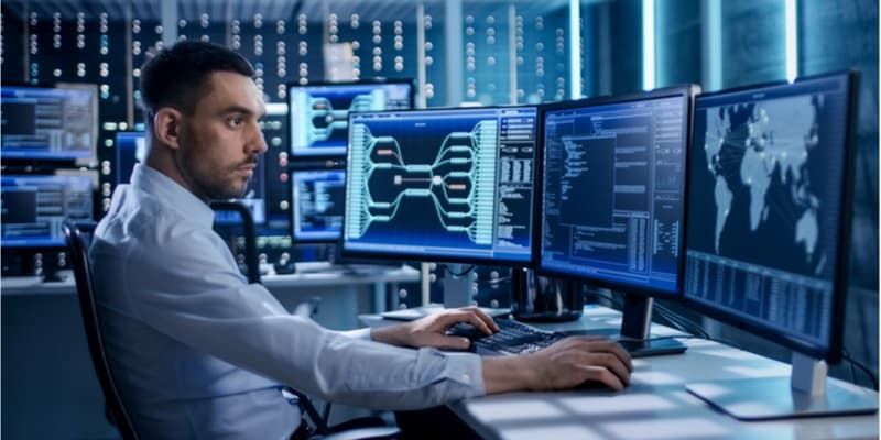 A data engineer working on his computer.