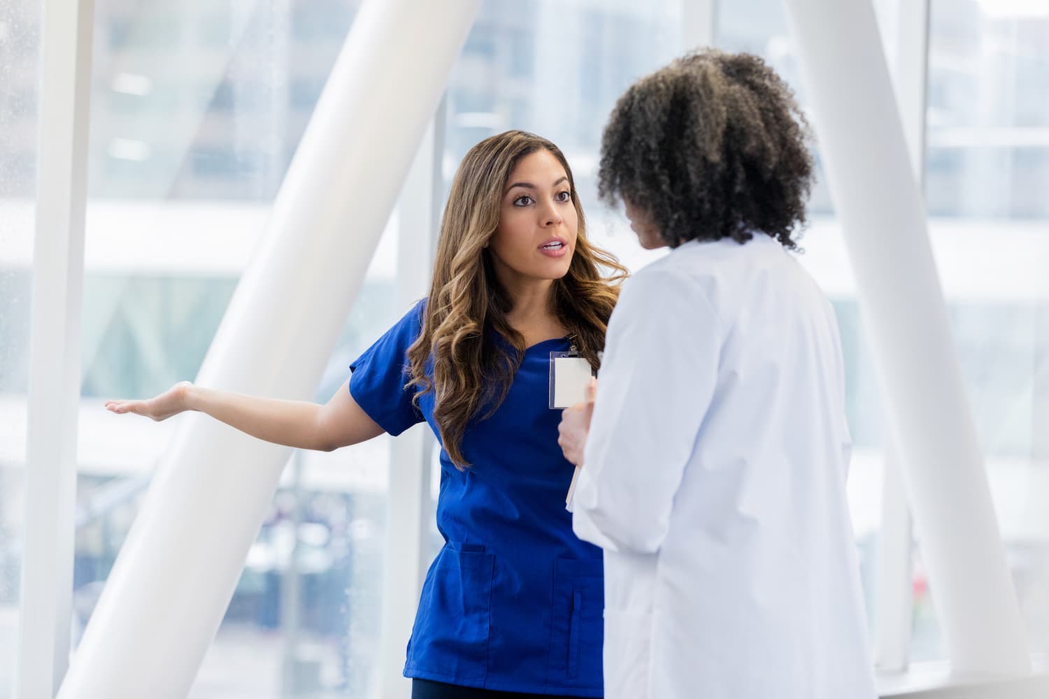 Female healthcare professionals disagree about a patient diagnosis.