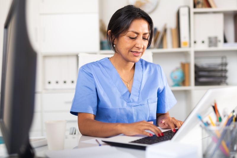 "A nurse studying her Master of Nursing"