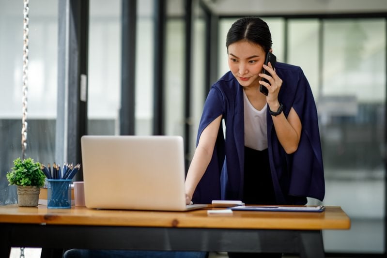 MBA student on her laptop and phone