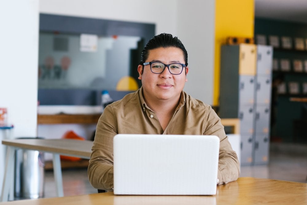 A student studying psychology online through a laptop.