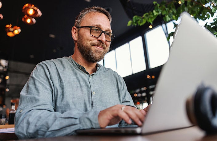 A man studying on the computer