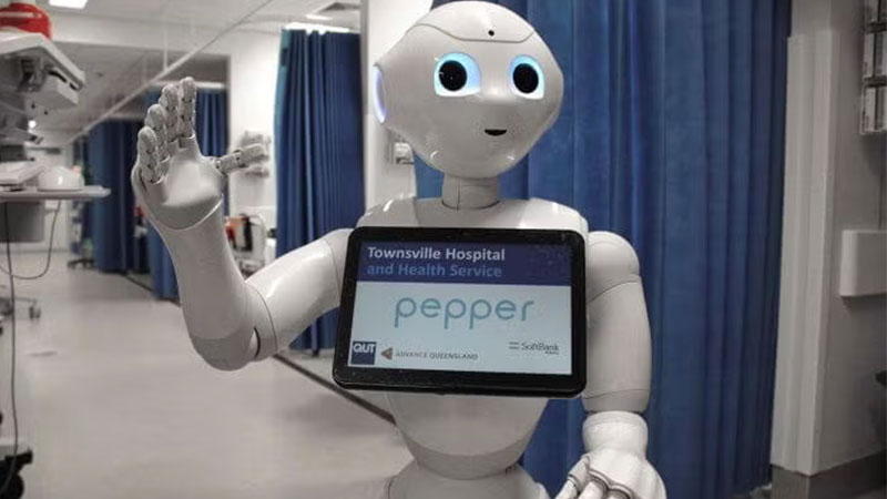 A robot assistant named Pepper assisting in a hospital with a display screen.